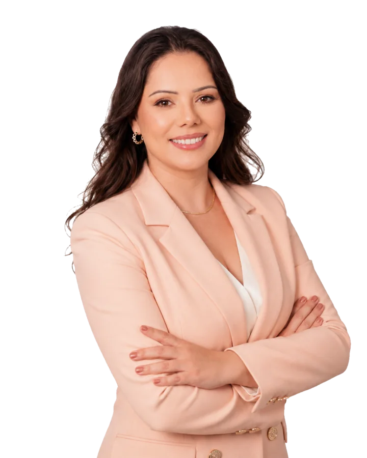 Franciele Sofiati smiling in a pale peach blazer.